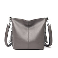 Load image into Gallery viewer, Women's High-Capacity Tassel Crossbody Bag – Leather Bucket Bag with Zipper Pocket