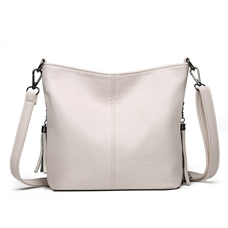 Women's High-Capacity Tassel Crossbody Bag – Leather Bucket Bag with Zipper Pocket