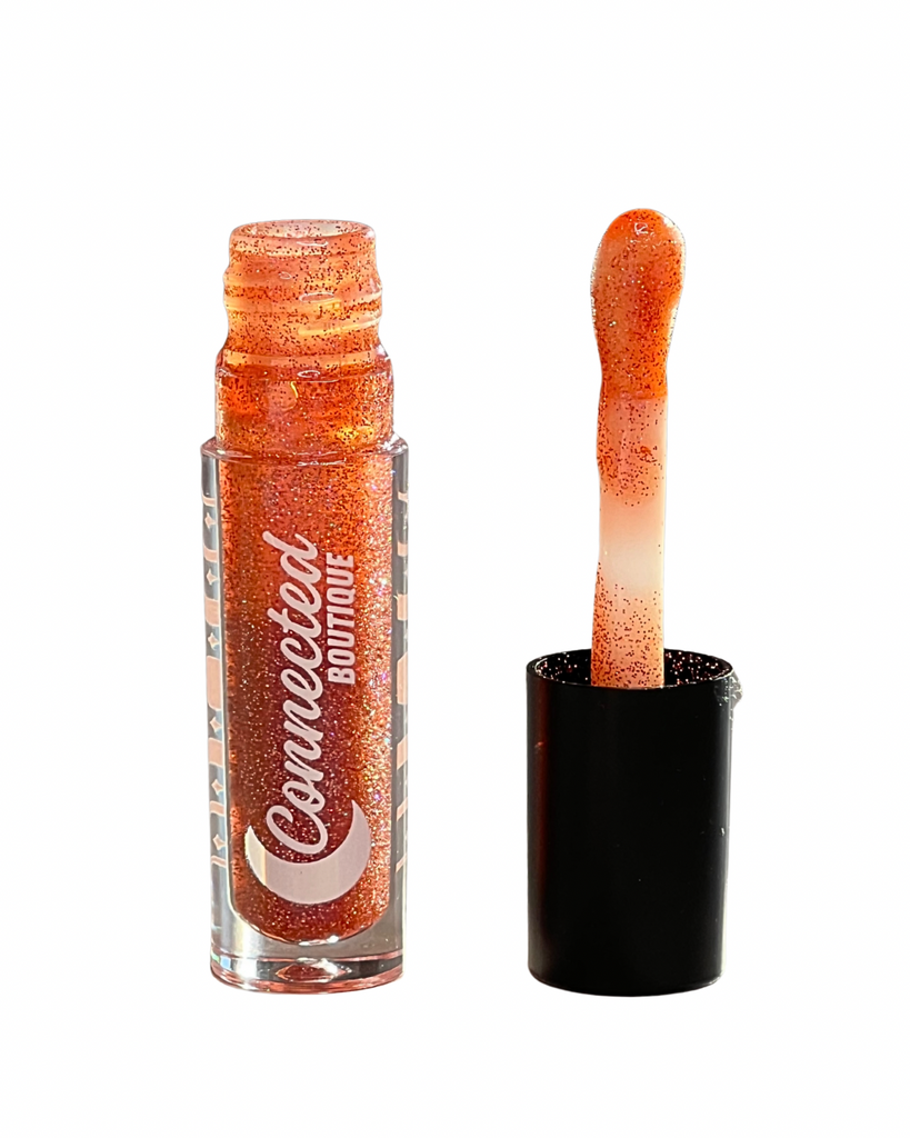 Promise pink duochrome lip gloss with duochrome glitter apple scented
