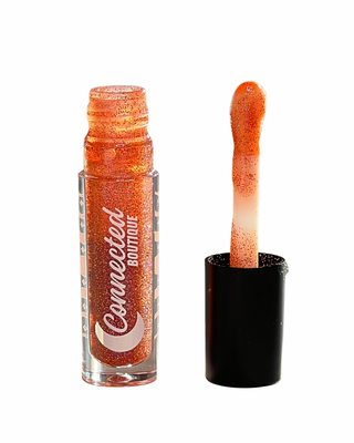 Promise pink duochrome lip gloss with duochrome glitter apple scented