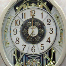 Load image into Gallery viewer, Moving Face Pendulum Wall Clock - Plays Melodies Every Hour