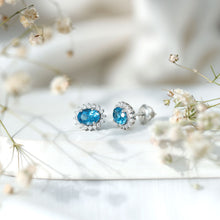 Load image into Gallery viewer, 1.6 Carat Oval London Blue Topaz Stud Earrings with Diamond Halo
