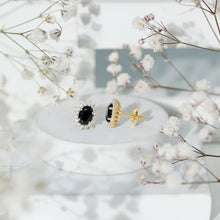 Load image into Gallery viewer, 2 Carat Oval Shaped Black and White Diamond Stud Earrings in Yellow Gold Plated Silver