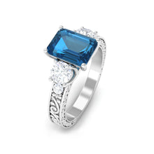 Load image into Gallery viewer, 6X8mm Emerald Cut London Blue Topaz Statement Ring with Engraved Shank