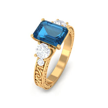 Load image into Gallery viewer, 6X8mm Emerald Cut London Blue Topaz Statement Ring with Engraved Shank