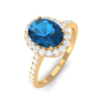 Load image into Gallery viewer, 2 CT Oval Cut London Blue Topaz Solitaire Ring with Diamond Halo