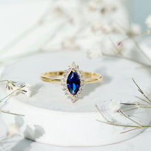 Load image into Gallery viewer, Marquise Cut Lab Grown Blue Sapphire and Diamond Halo Engagement Ring