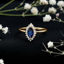 Load image into Gallery viewer, Marquise Cut Lab Grown Blue Sapphire and Diamond Halo Engagement Ring