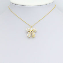 Load image into Gallery viewer, White Pearl Gold Bow Shape Charm Pendant, Sku#A457